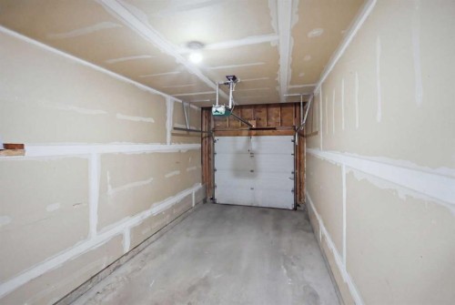 47 Bridlewood View Sw, Calgary, AB - Indoor Photo Showing Garage