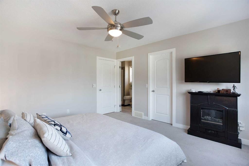 7 Emberside Hollow, Cochrane, AB - Indoor Photo Showing Bedroom