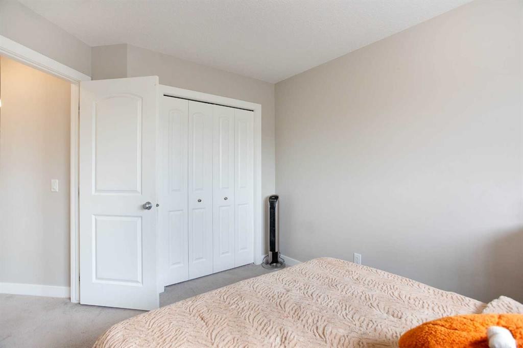 7 Emberside Hollow, Cochrane, AB - Indoor Photo Showing Bedroom