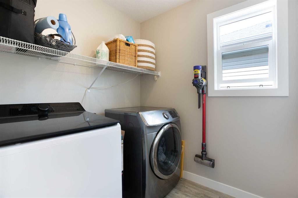 7 Emberside Hollow, Cochrane, AB - Indoor Photo Showing Laundry Room
