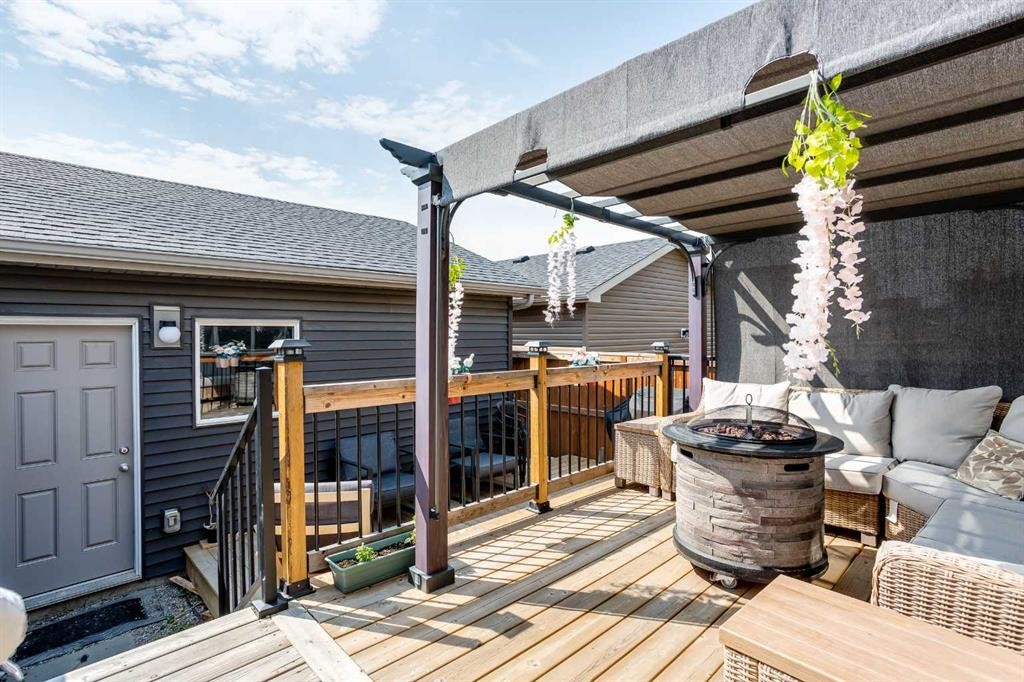 7 Emberside Hollow, Cochrane, AB - Outdoor With Deck Patio Veranda With Exterior