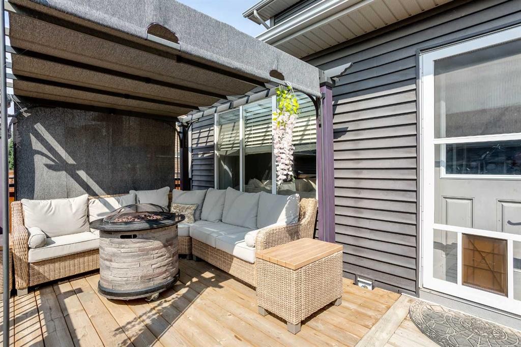 7 Emberside Hollow, Cochrane, AB - Outdoor With Deck Patio Veranda With Exterior
