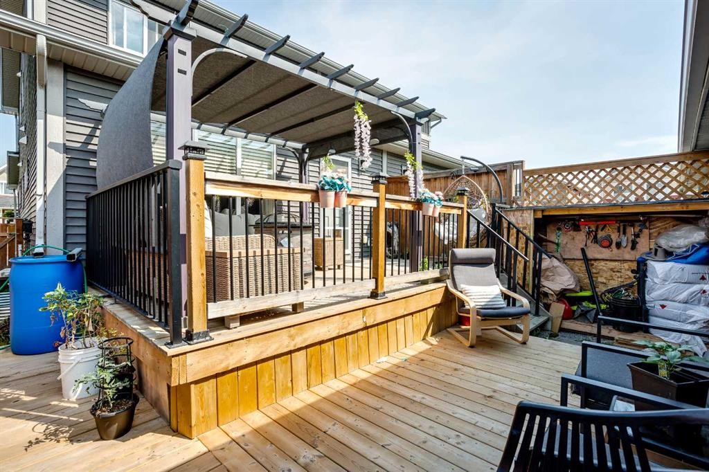 7 Emberside Hollow, Cochrane, AB - Outdoor With Deck Patio Veranda With Exterior