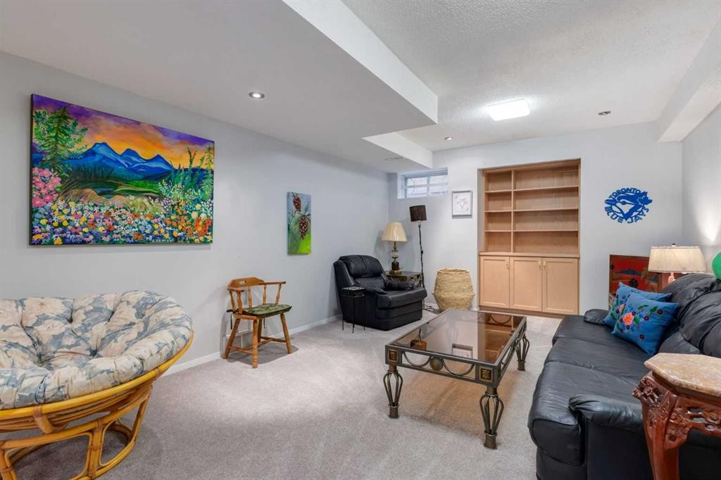660 Coach Grove Road Sw, Calgary, AB - Indoor Photo Showing Living Room