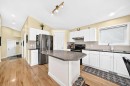 50 Somerside Manor Sw, Calgary, AB  - Indoor Photo Showing Kitchen With Double Sink 