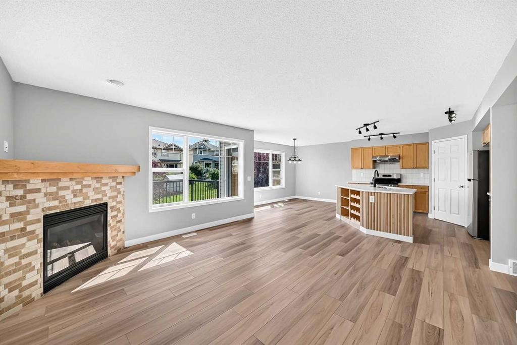 94 Panamount Rise Nw, Calgary, AB - Indoor Photo Showing Living Room With Fireplace