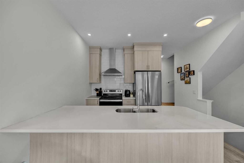 152-380 Seton Villas Se, Calgary, AB - Indoor Photo Showing Kitchen With Stainless Steel Kitchen With Upgraded Kitchen