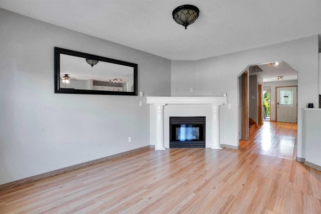 158 Saratoga Close Ne, Calgary, AB - Indoor Photo Showing Living Room With Fireplace