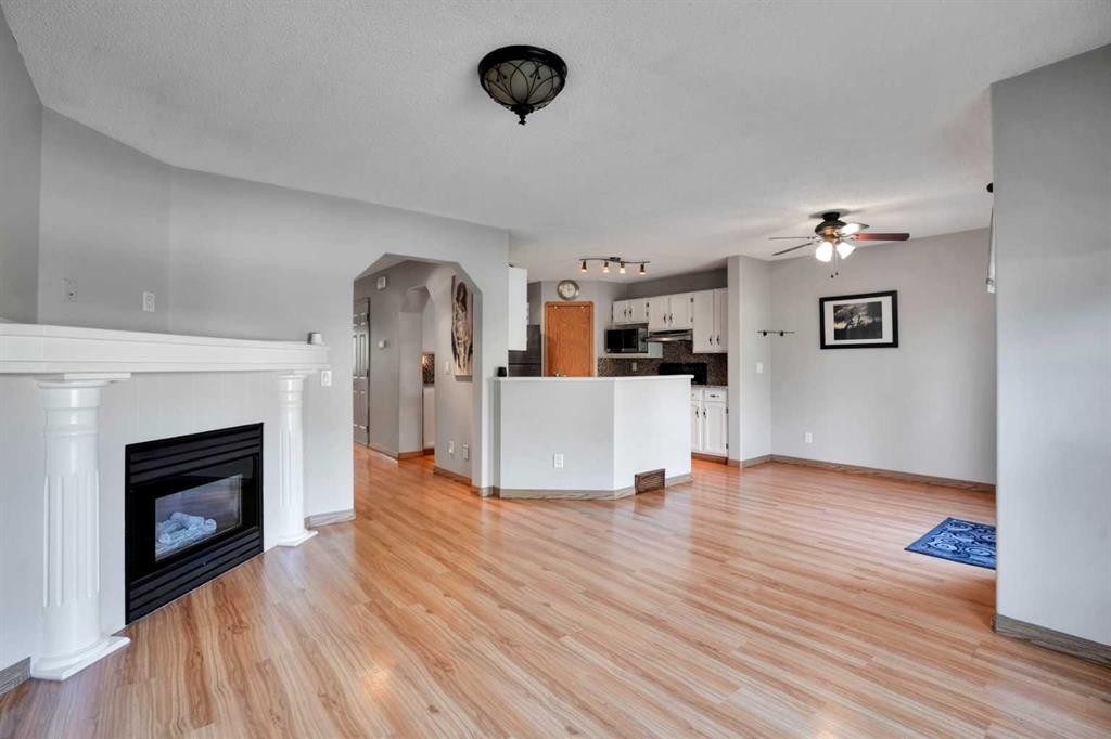 158 Saratoga Close Ne, Calgary, AB - Indoor Photo Showing Living Room With Fireplace
