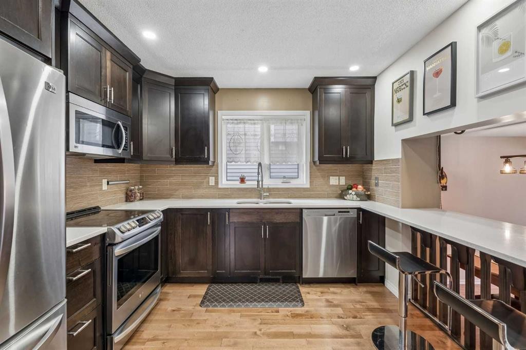 744 Riverbend Drive Se, Calgary, AB - Indoor Photo Showing Kitchen With Stainless Steel Kitchen With Upgraded Kitchen