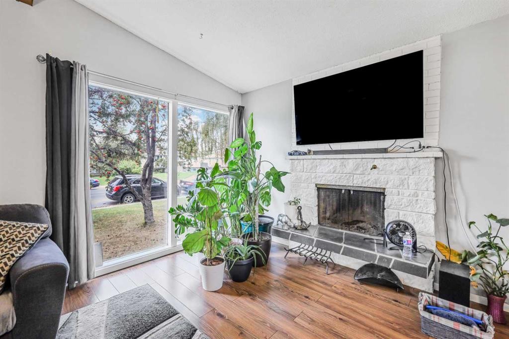 5112 Maryvale Drive Ne, Calgary, AB - Indoor Photo Showing Living Room With Fireplace