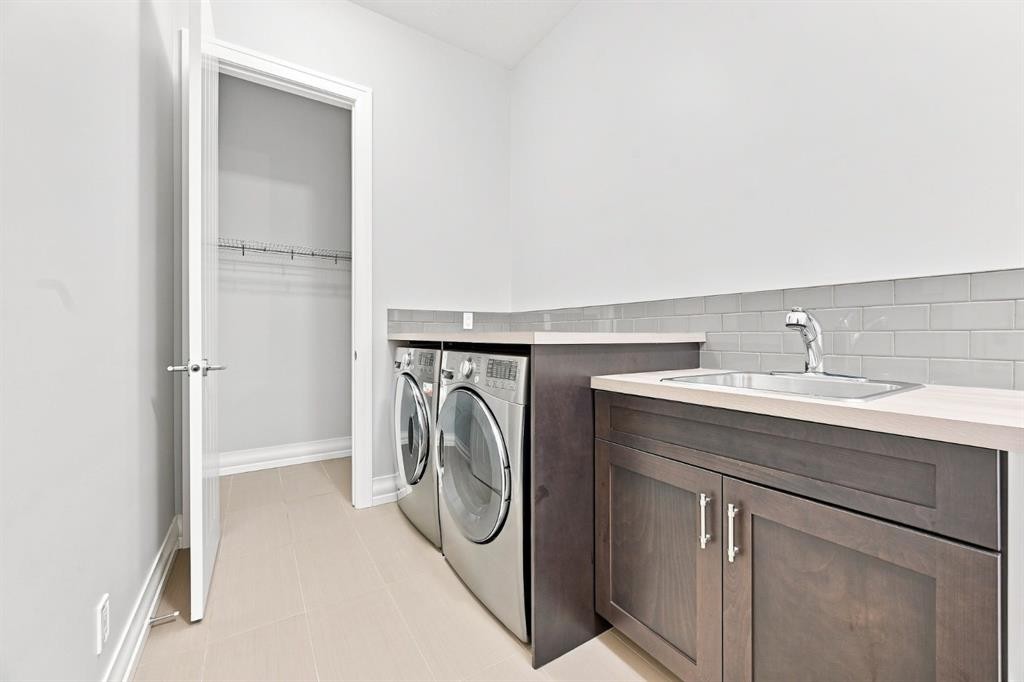 117 Spring Water Close, Heritage Pointe, AB - Indoor Photo Showing Laundry Room