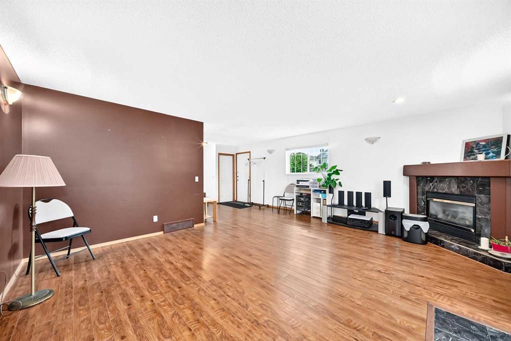 98 Country Hills Heights Nw, Calgary, AB - Indoor Photo Showing Living Room With Fireplace