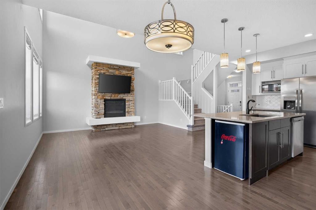 80 Nolancrest Green Nw, Calgary, AB - Indoor Photo Showing Kitchen With Fireplace