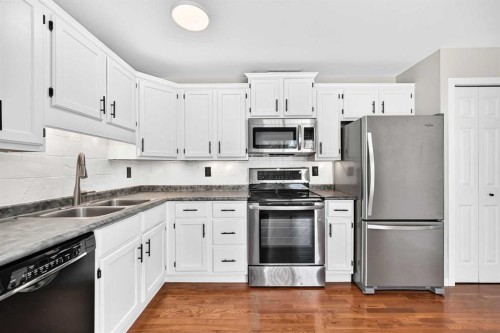116 Mckerrell Close Se, Calgary, AB - Indoor Photo Showing Kitchen With Stainless Steel Kitchen With Double Sink