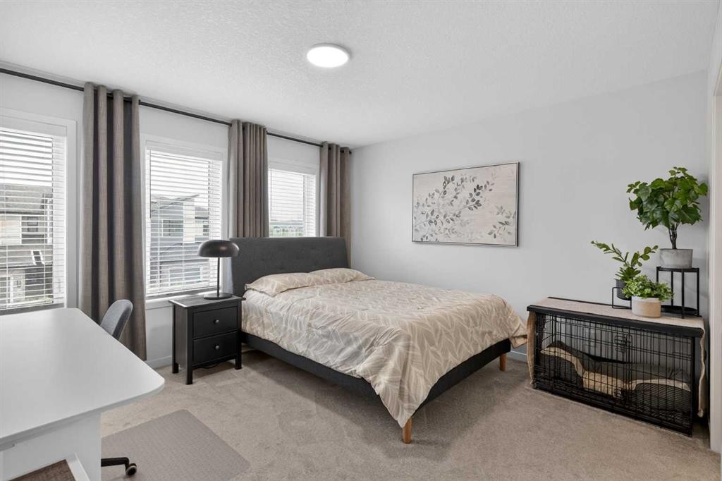 374 Wolf Creek Manor Se, Calgary, AB - Indoor Photo Showing Bedroom