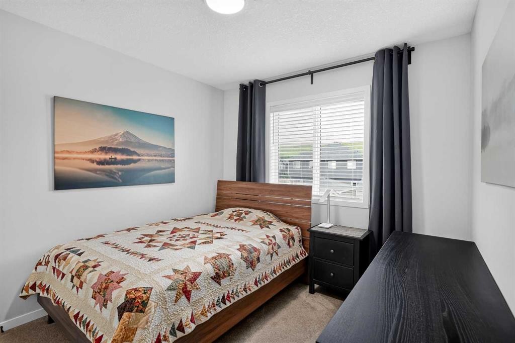 374 Wolf Creek Manor Se, Calgary, AB - Indoor Photo Showing Bedroom