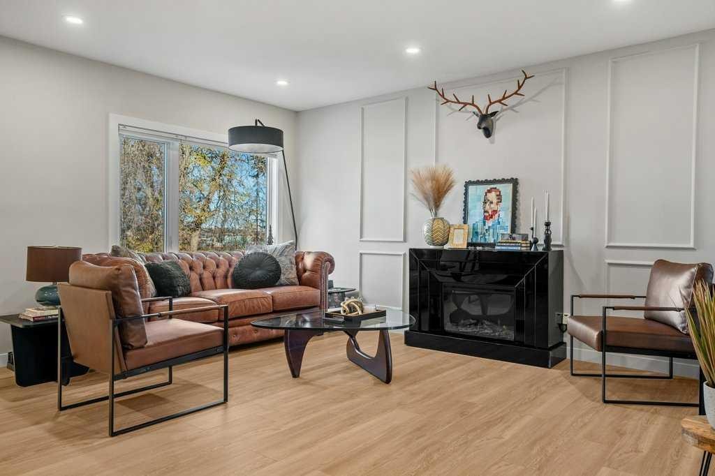 2316 State Road Sw, Calgary, AB - Indoor Photo Showing Living Room With Fireplace