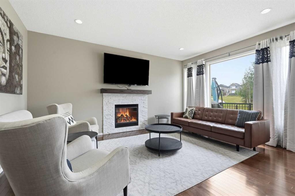 79 Nolanfield Court Nw, Calgary, AB - Indoor Photo Showing Living Room With Fireplace