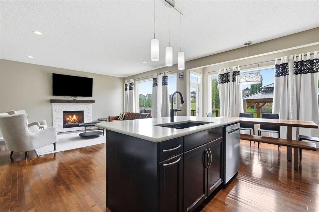 79 Nolanfield Court Nw, Calgary, AB - Indoor Photo Showing Kitchen With Fireplace With Double Sink With Upgraded Kitchen
