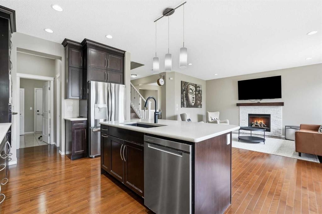 79 Nolanfield Court Nw, Calgary, AB - Indoor Photo Showing Kitchen With Fireplace With Upgraded Kitchen