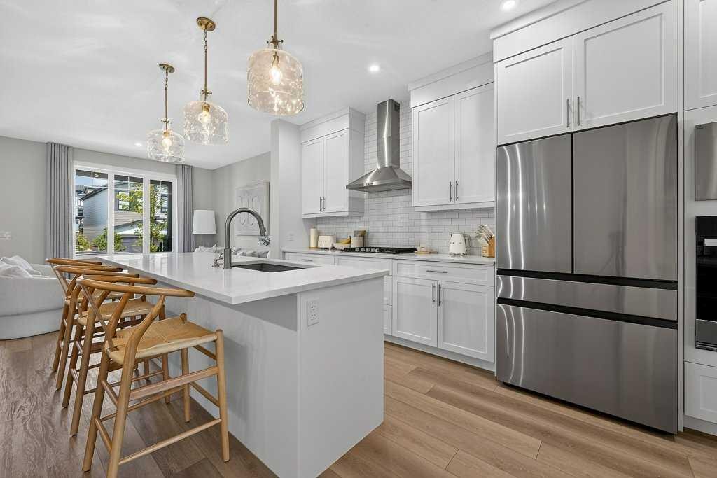 97 Rowmont Heath Nw, Calgary, AB - Indoor Photo Showing Kitchen With Stainless Steel Kitchen With Upgraded Kitchen