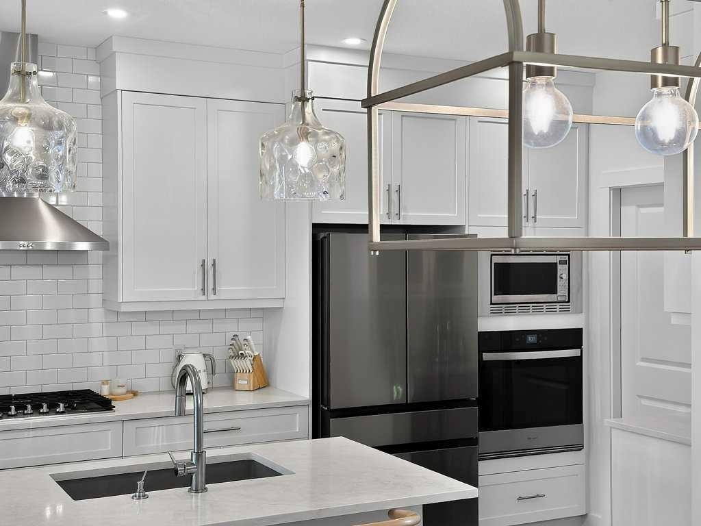 97 Rowmont Heath Nw, Calgary, AB - Indoor Photo Showing Kitchen With Upgraded Kitchen
