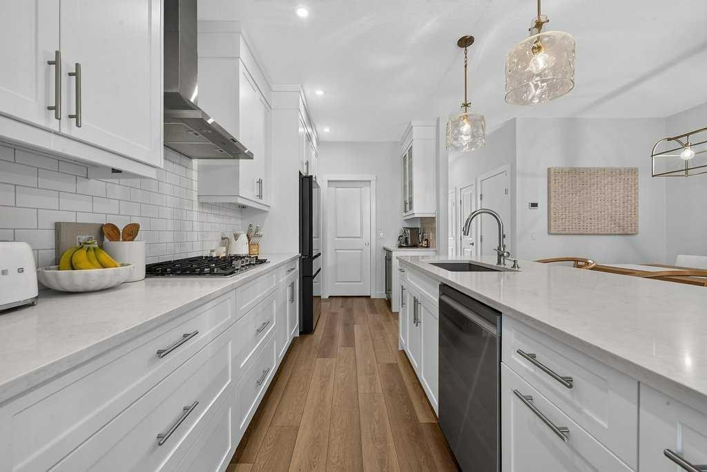97 Rowmont Heath Nw, Calgary, AB - Indoor Photo Showing Kitchen With Upgraded Kitchen