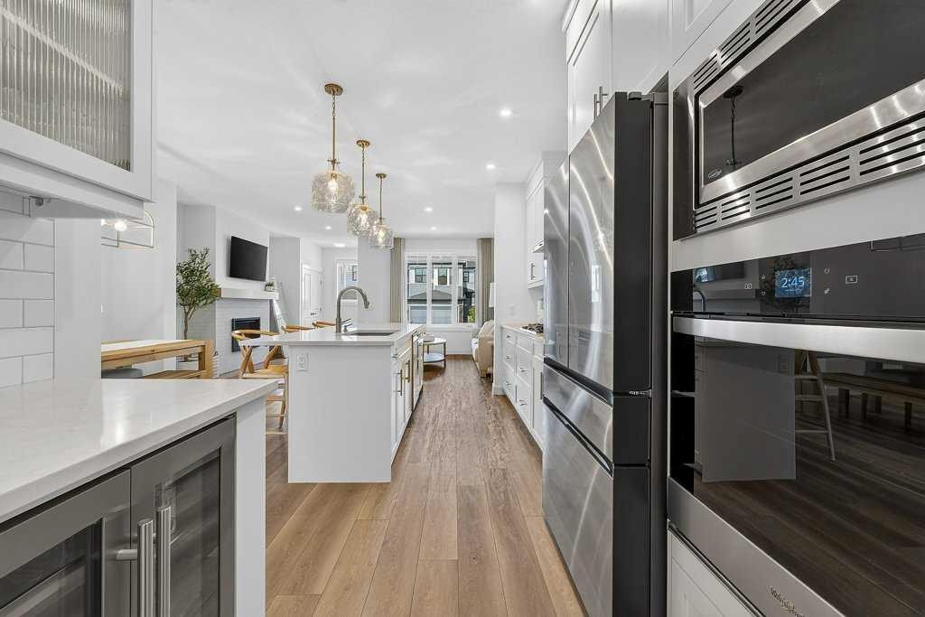97 Rowmont Heath Nw, Calgary, AB - Indoor Photo Showing Kitchen With Stainless Steel Kitchen With Upgraded Kitchen
