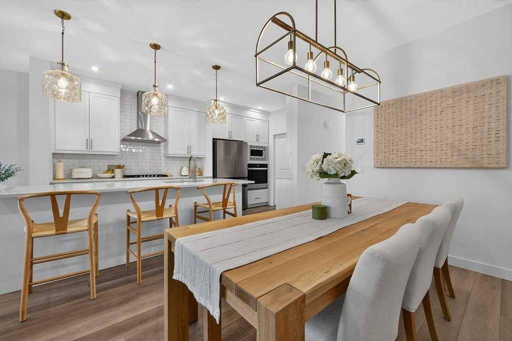 97 Rowmont Heath Nw, Calgary, AB - Indoor Photo Showing Dining Room