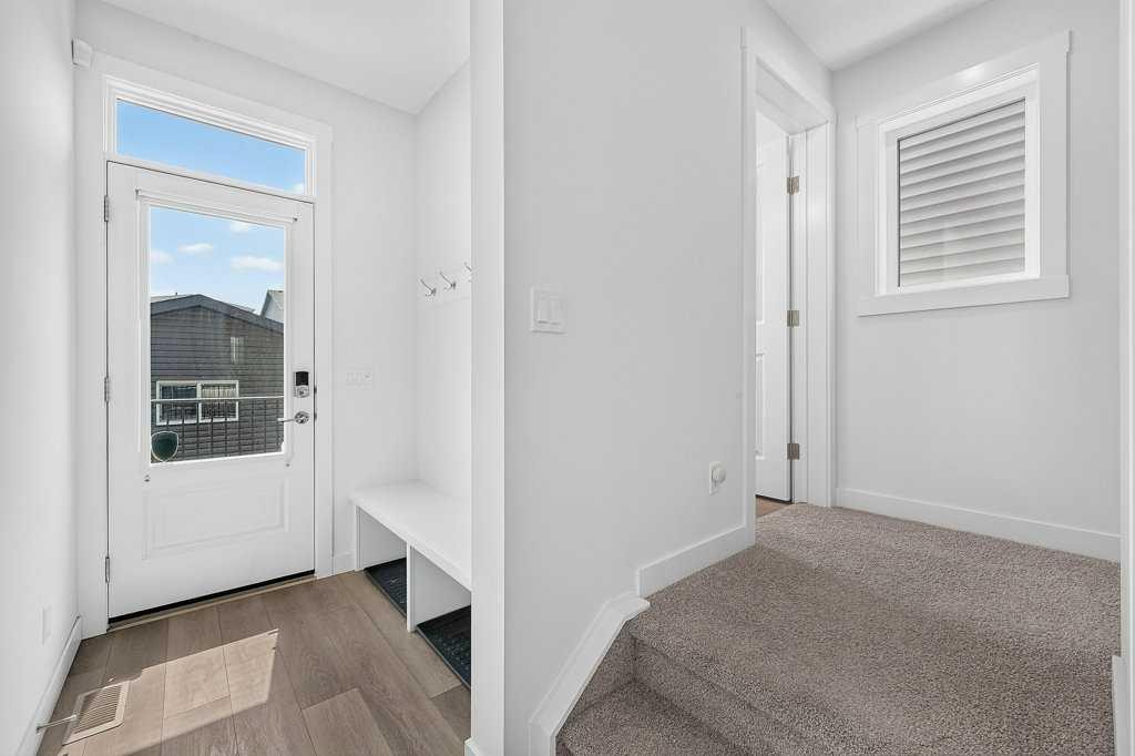97 Rowmont Heath Nw, Calgary, AB - Indoor Photo Showing Other Room