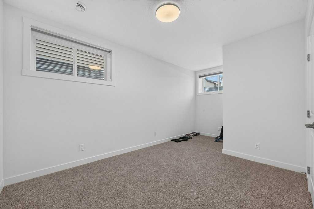 97 Rowmont Heath Nw, Calgary, AB - Indoor Photo Showing Other Room