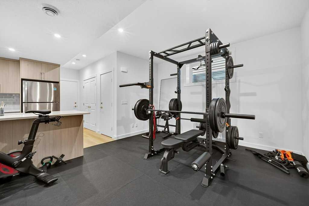 97 Rowmont Heath Nw, Calgary, AB - Indoor Photo Showing Gym Room