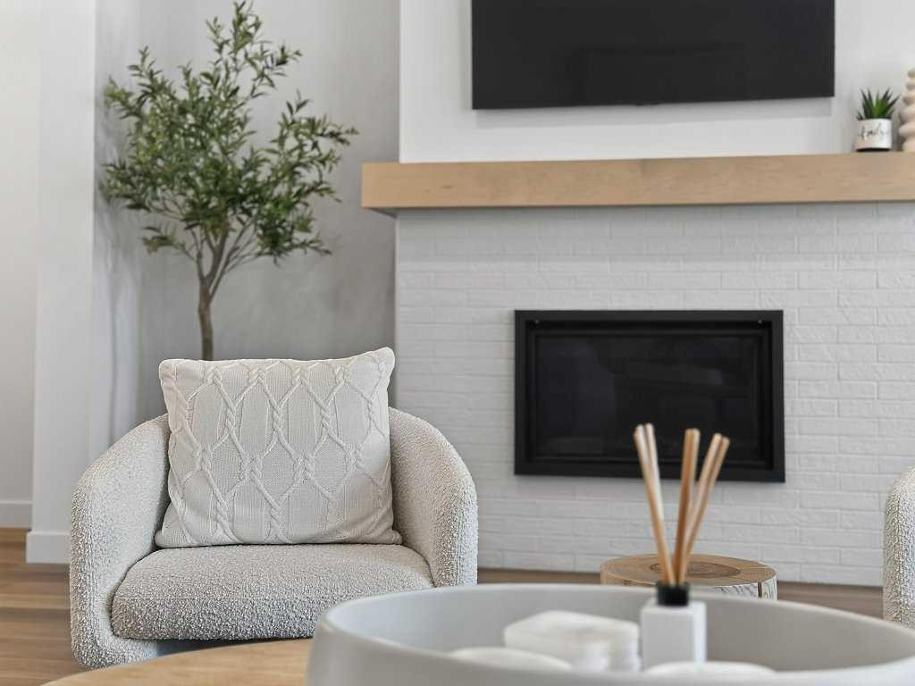 97 Rowmont Heath Nw, Calgary, AB - Indoor Photo Showing Living Room With Fireplace