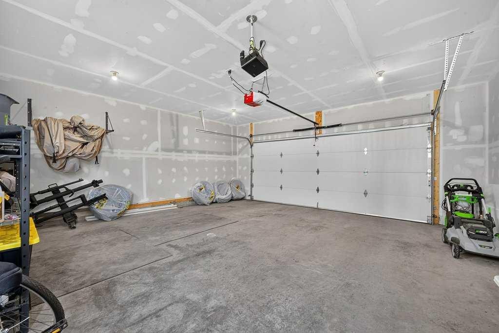 97 Rowmont Heath Nw, Calgary, AB - Indoor Photo Showing Garage