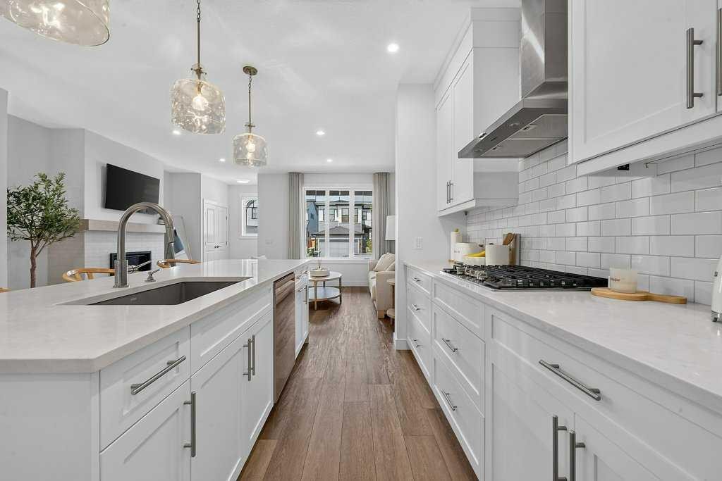 97 Rowmont Heath Nw, Calgary, AB - Indoor Photo Showing Kitchen With Upgraded Kitchen