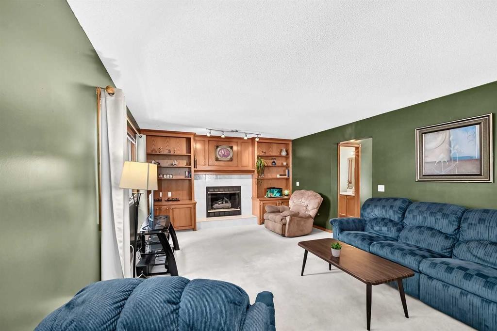 228 Arbour Ridge Way Nw, Calgary, AB - Indoor Photo Showing Living Room With Fireplace