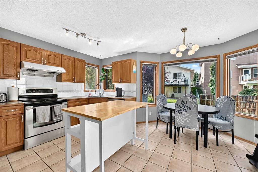 228 Arbour Ridge Way Nw, Calgary, AB - Indoor Photo Showing Kitchen With Double Sink