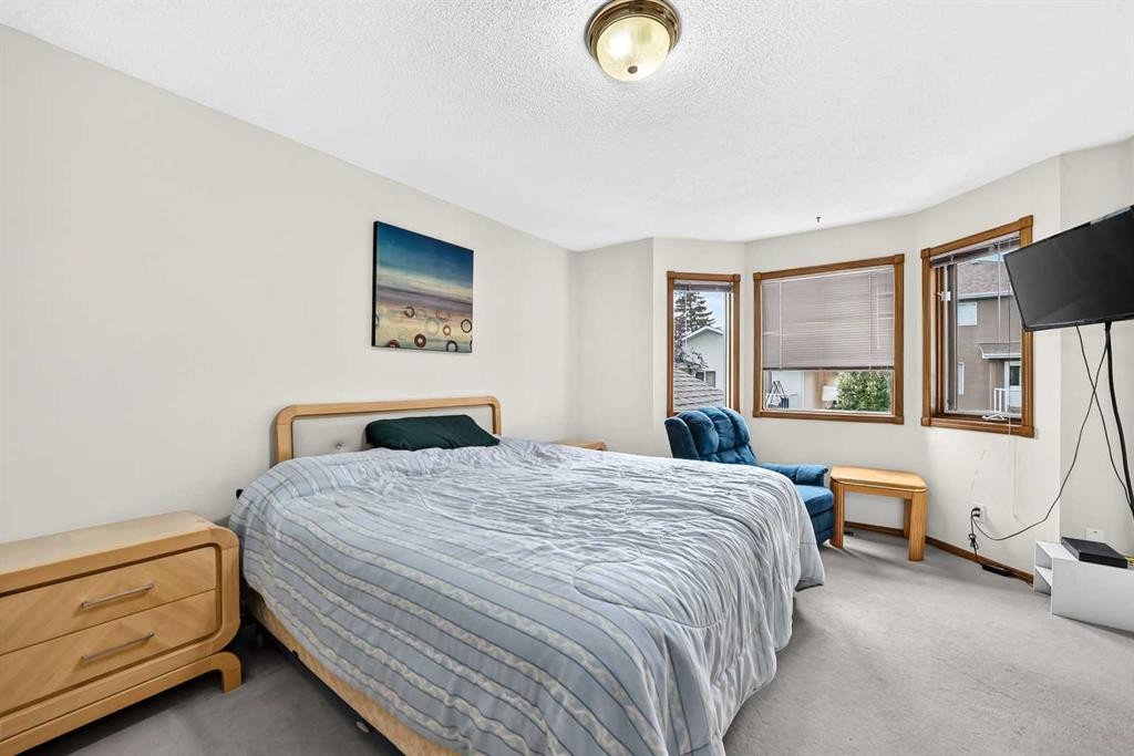 228 Arbour Ridge Way Nw, Calgary, AB - Indoor Photo Showing Bedroom