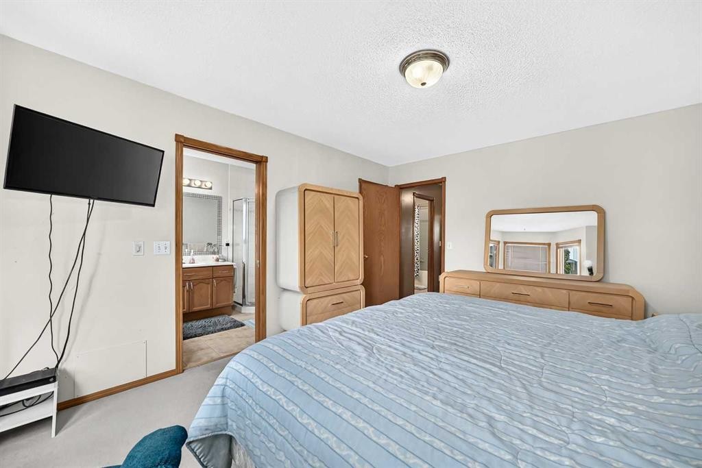 228 Arbour Ridge Way Nw, Calgary, AB - Indoor Photo Showing Bedroom