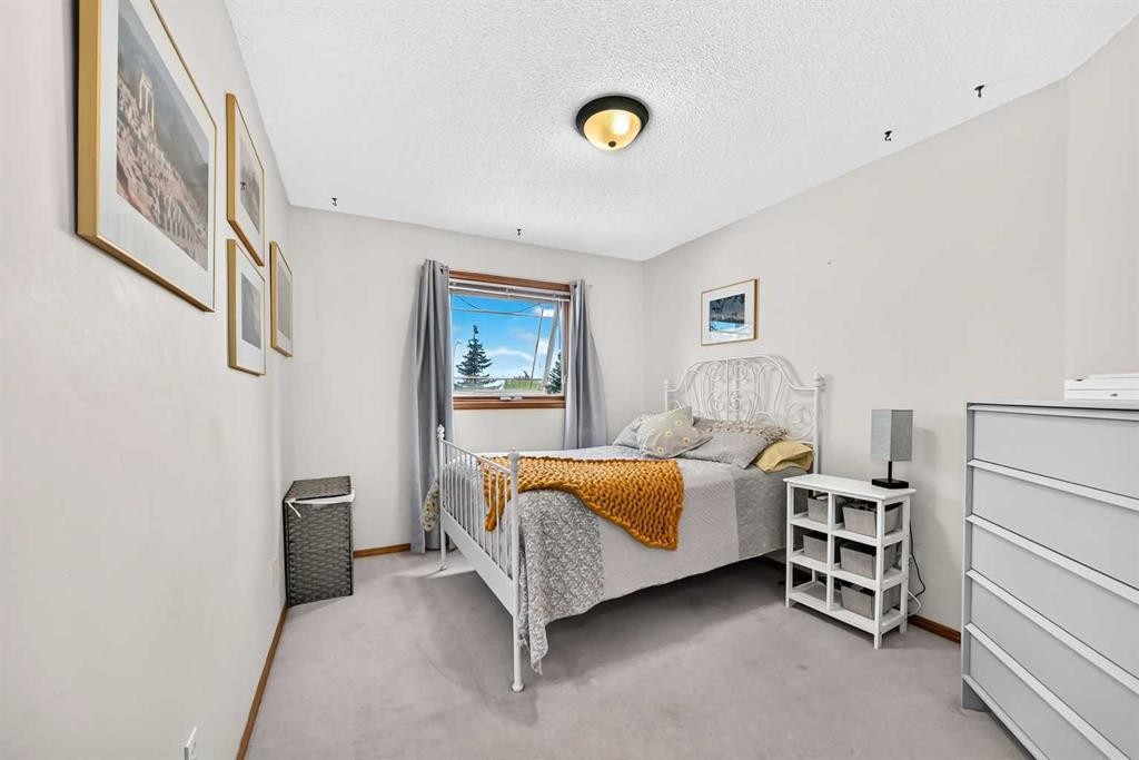 228 Arbour Ridge Way Nw, Calgary, AB - Indoor Photo Showing Bedroom