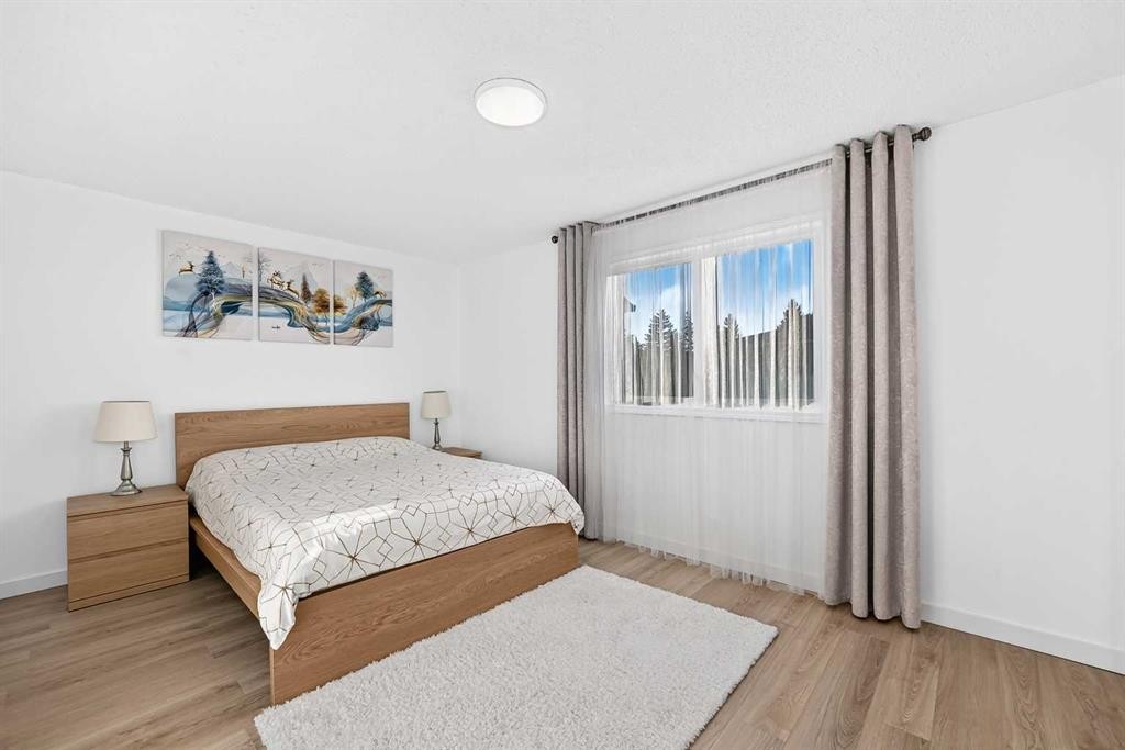 135 Woodsman Lane Sw, Calgary, AB - Indoor Photo Showing Bedroom