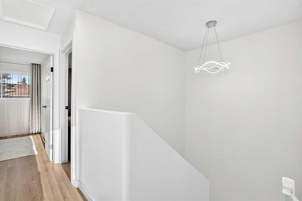 135 Woodsman Lane Sw, Calgary, AB - Indoor Photo Showing Other Room