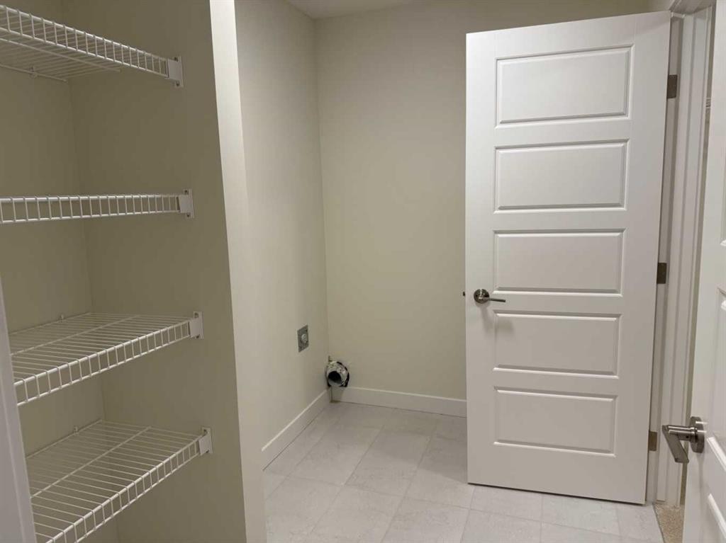 111 Sundown Crescent, Cochrane, AB - Indoor With Storage