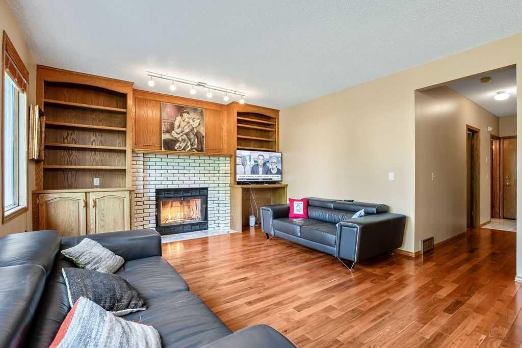 208 Hawkview Manor Place Nw, Calgary, AB - Indoor Photo Showing Living Room With Fireplace