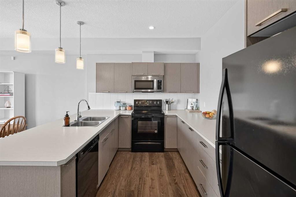 52 Saddlestone Drive Ne, Calgary, AB - Indoor Photo Showing Kitchen With Double Sink With Upgraded Kitchen