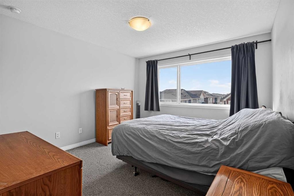 52 Saddlestone Drive Ne, Calgary, AB - Indoor Photo Showing Bedroom