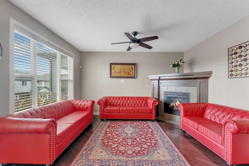 130 Brightonwoods Grove Se, Calgary, AB - Indoor Photo Showing Living Room With Fireplace