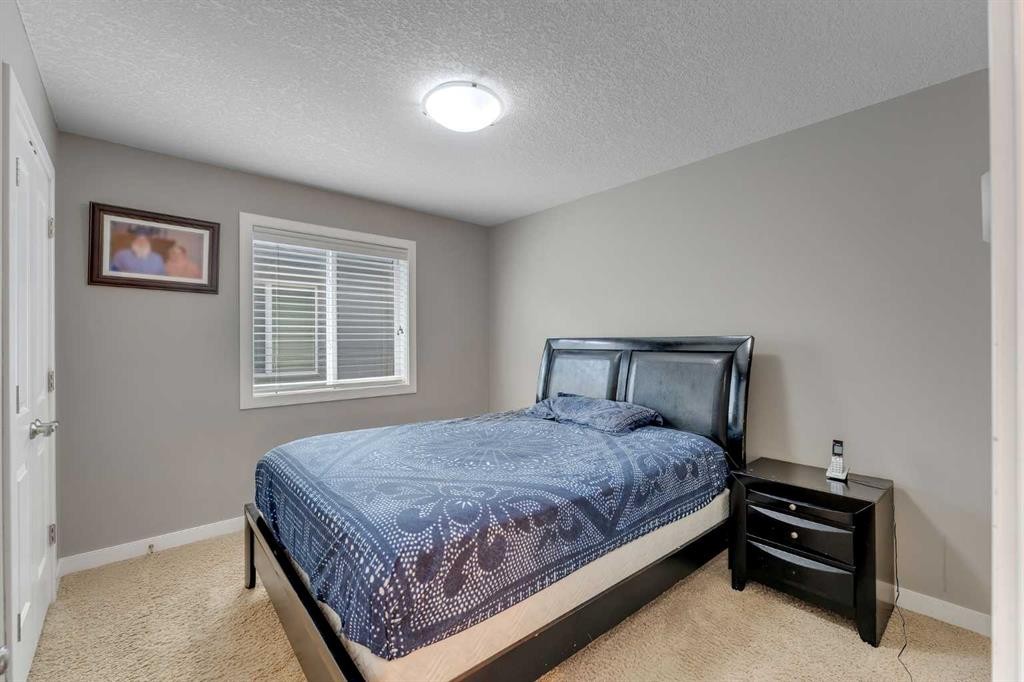 130 Brightonwoods Grove Se, Calgary, AB - Indoor Photo Showing Bedroom