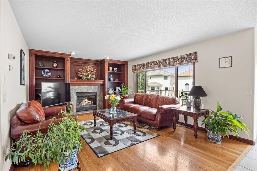 10385 Hamptons Boulevard Nw, Calgary, AB - Indoor Photo Showing Living Room With Fireplace